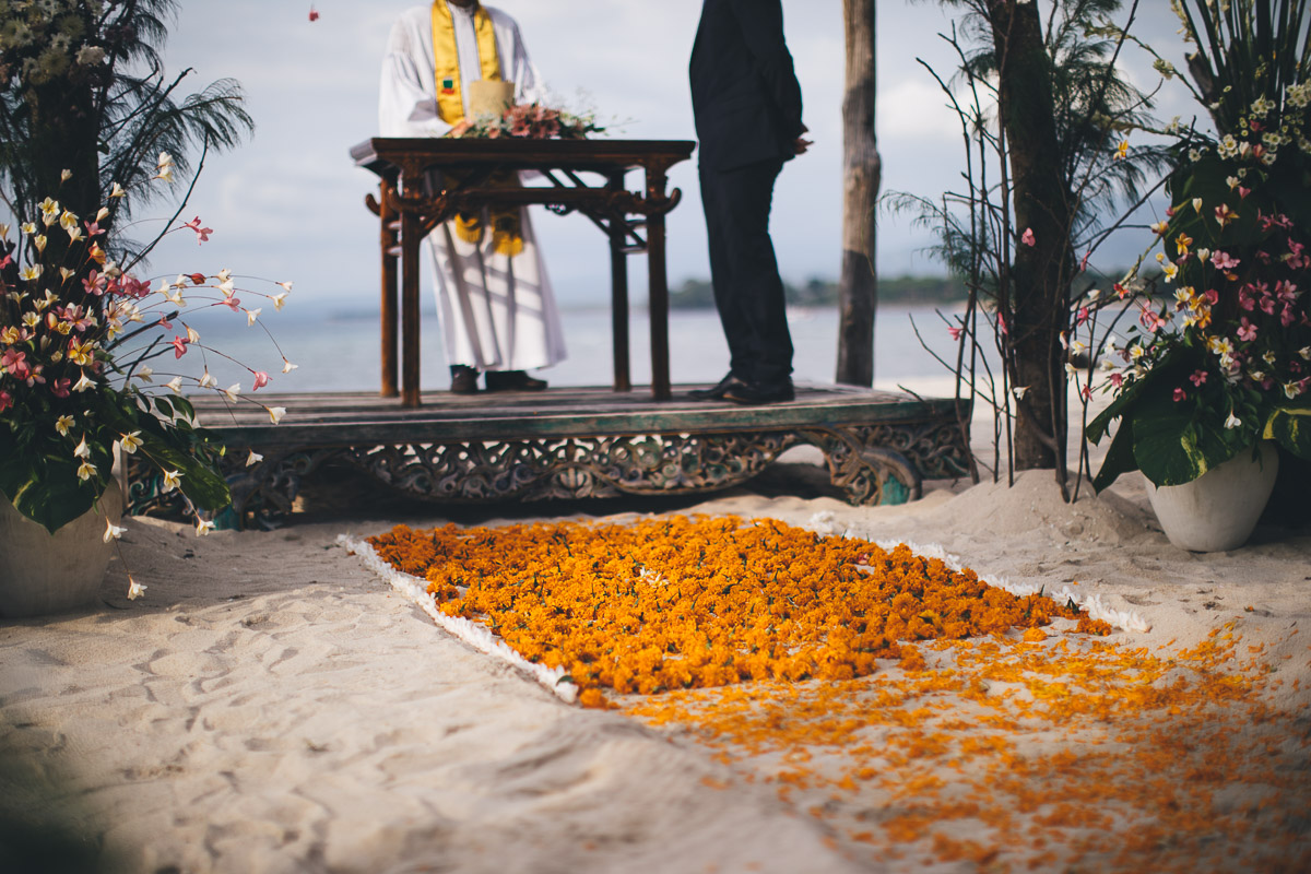 flower on the beach in front of the ceremony podium