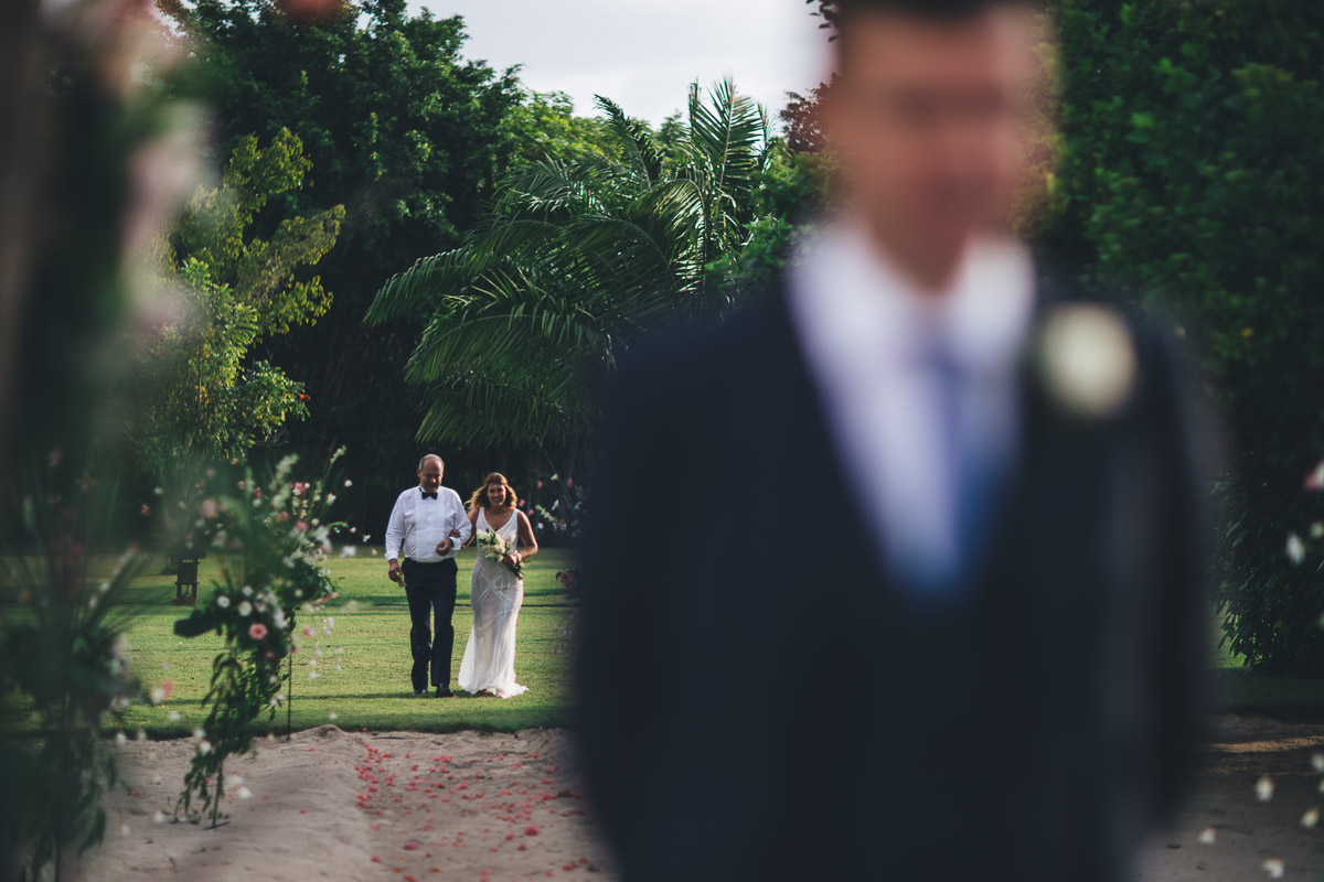 bride walking down the beach 