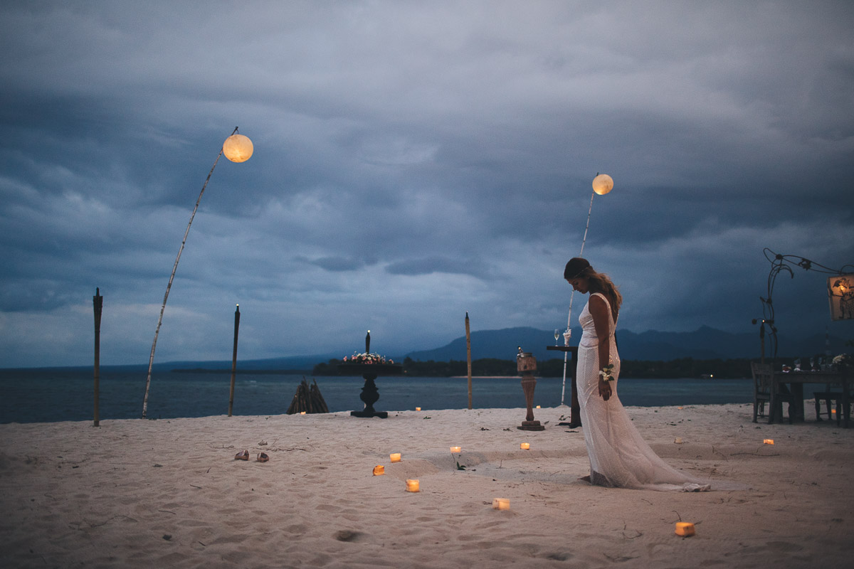 bride waits for the groom on the beach