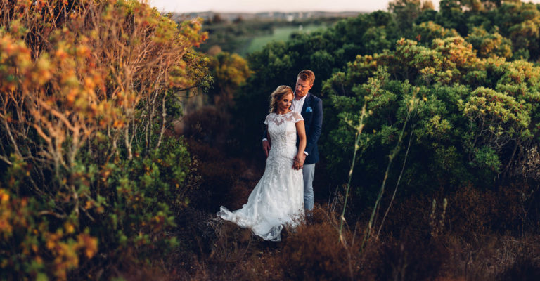 newly weds in sunset