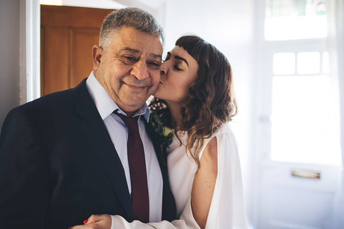 bride kisses father