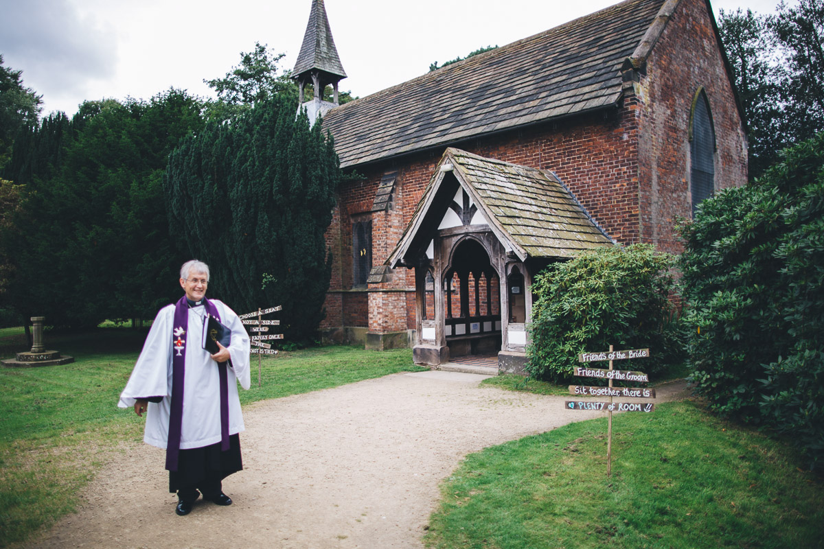 vicar outside chapel