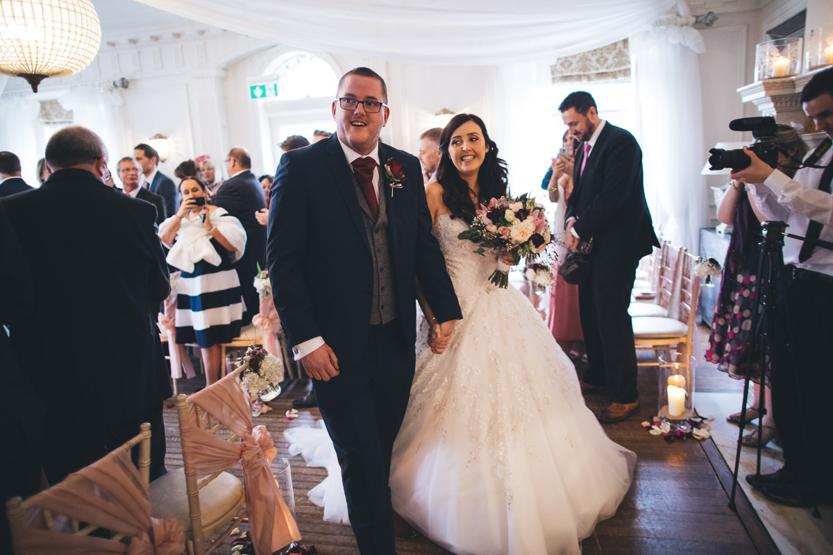 just married walking down the aisle