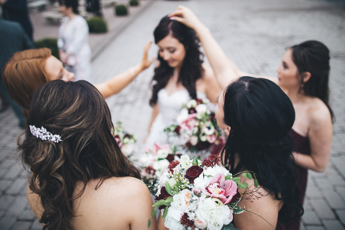 picking confetti out of brides hair