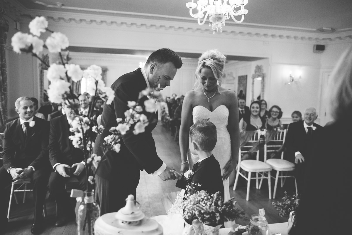 son shakes grooms hand