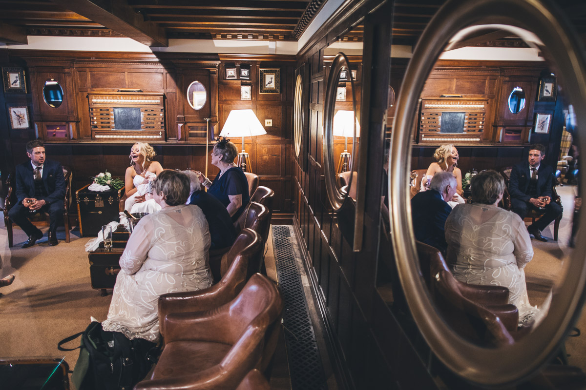 bride laughing shot through mirror