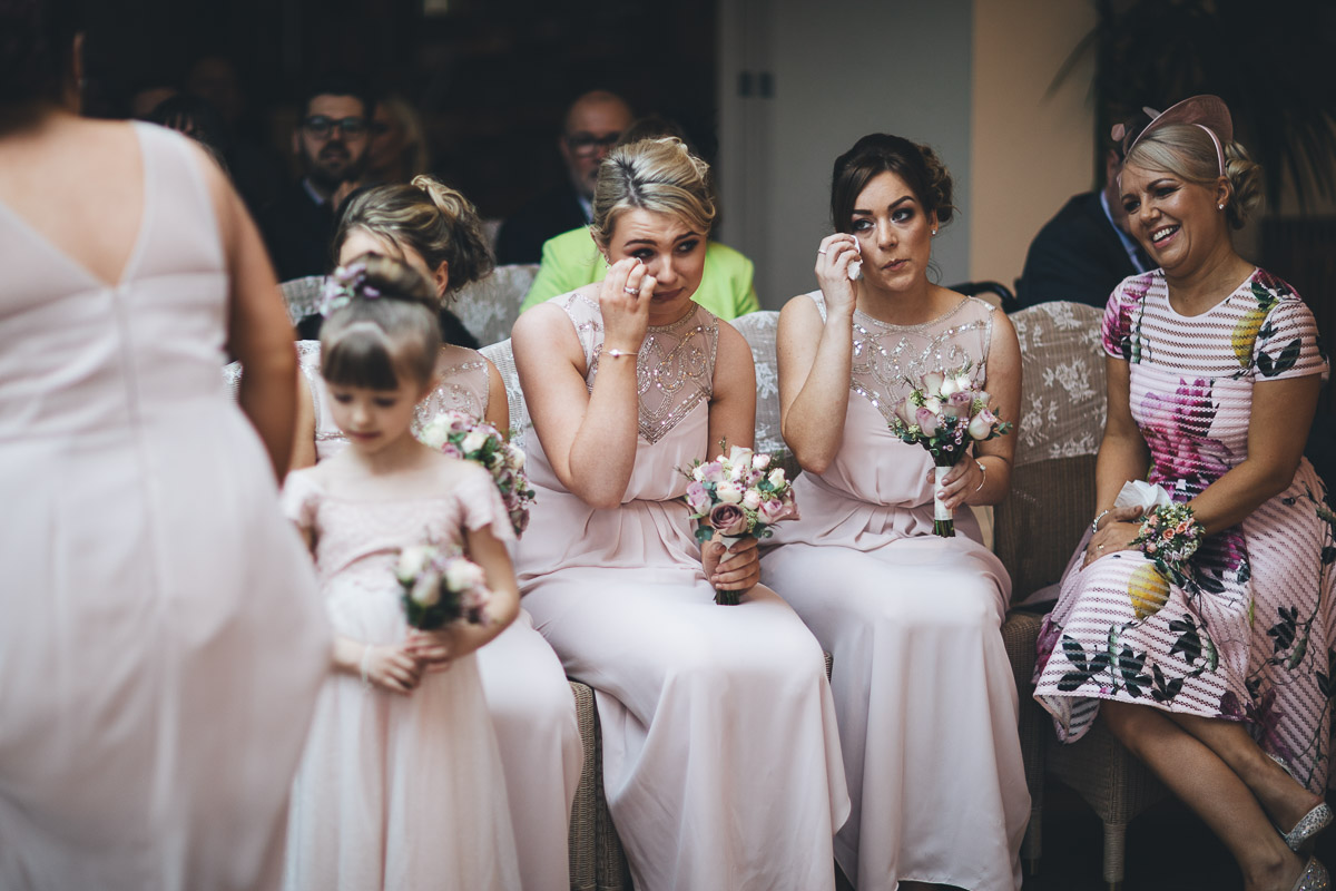 bridesmaids wiping away tears