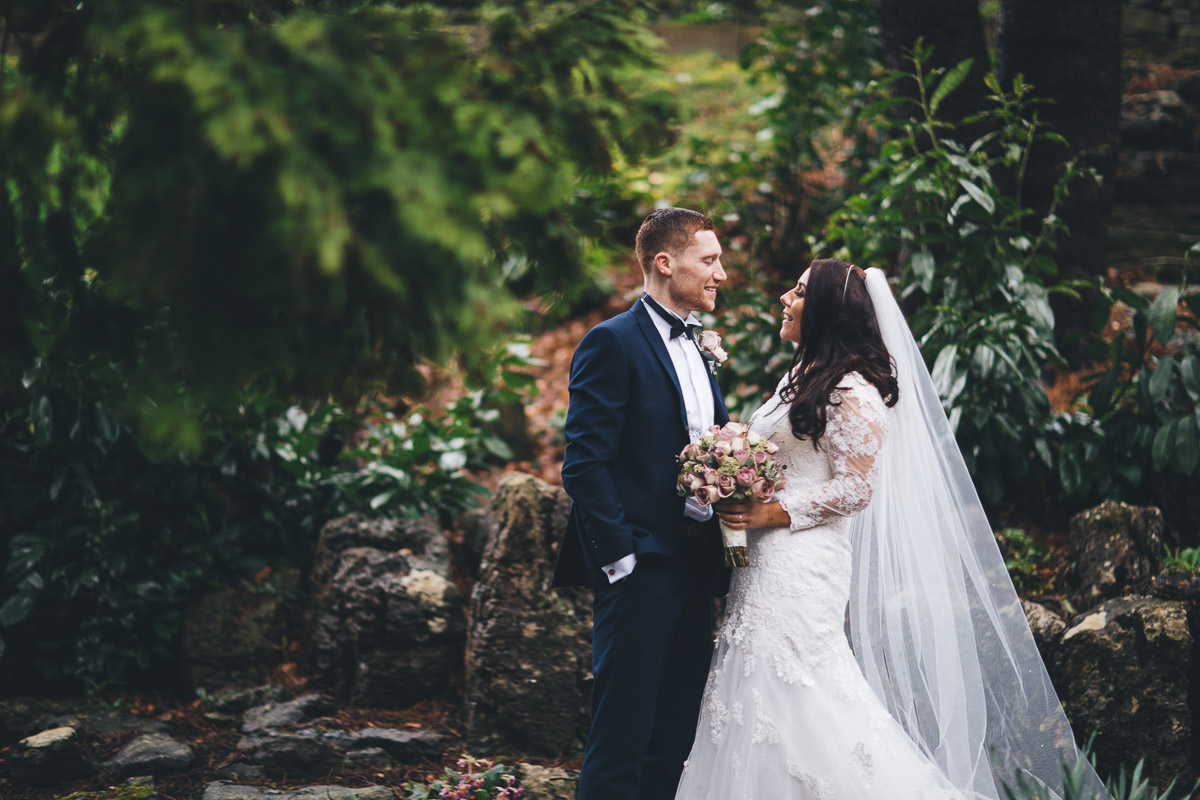 bride and groom in garden at mitton hall