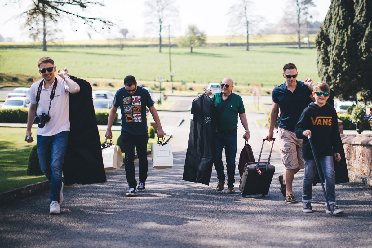 Groom and friends arriving at wedding venue