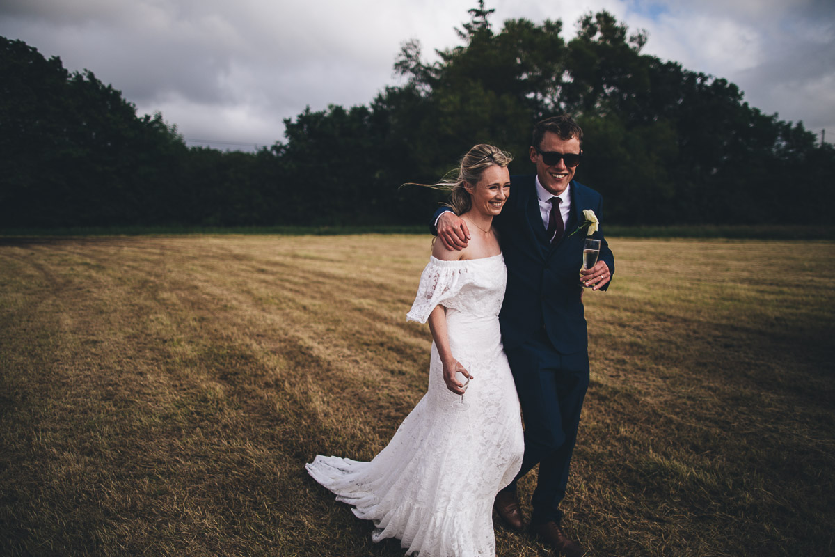 bride and groom with drinks during their wedding