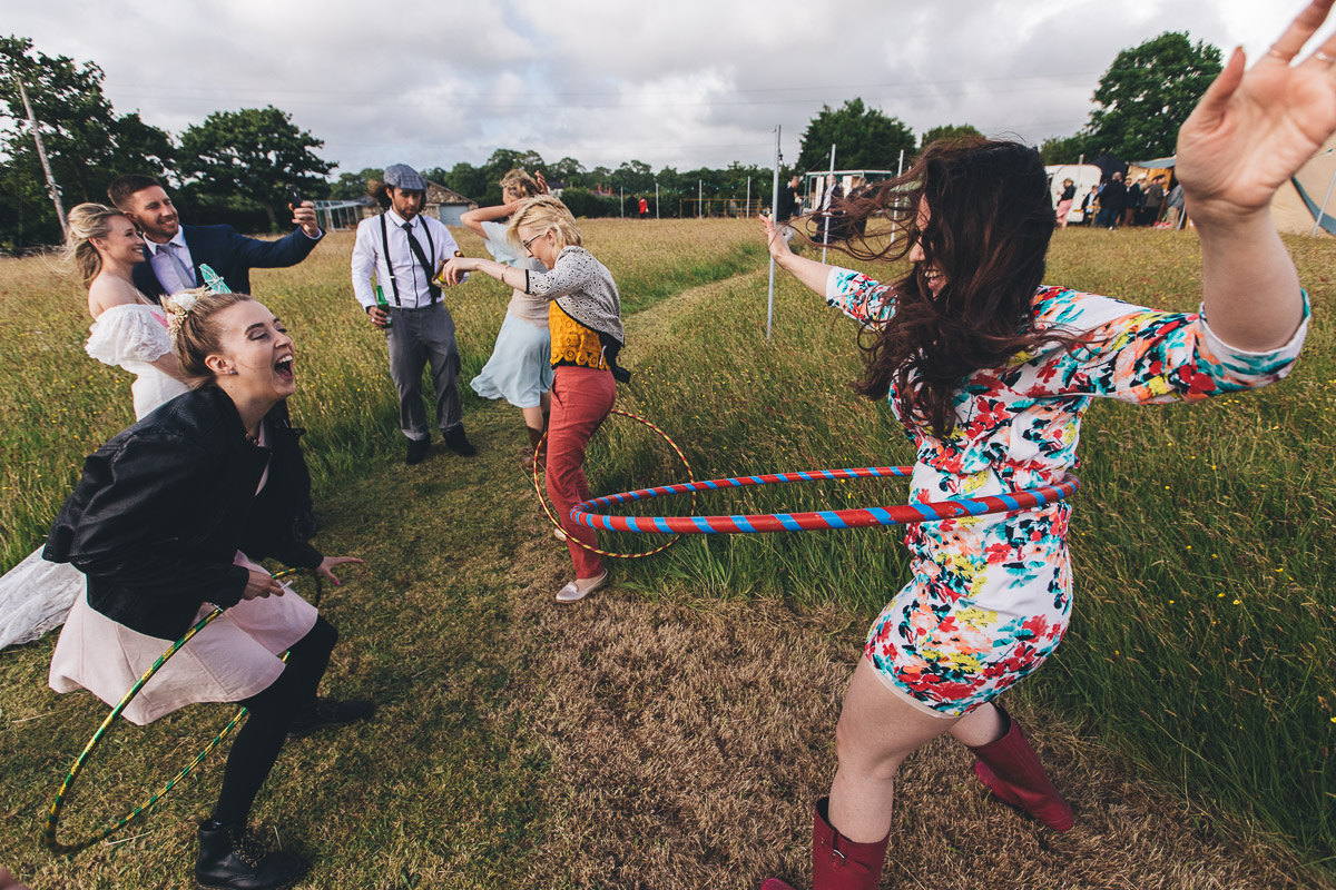 wedding guests have fun with hula hoops