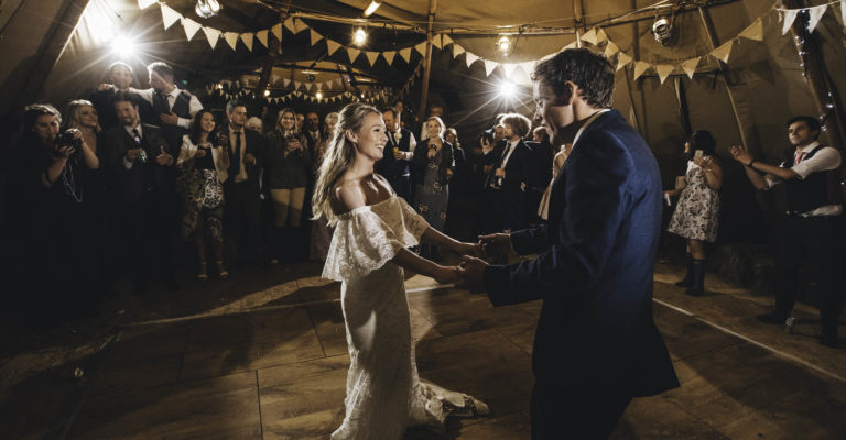 first dance with bride and groom inside the tipi