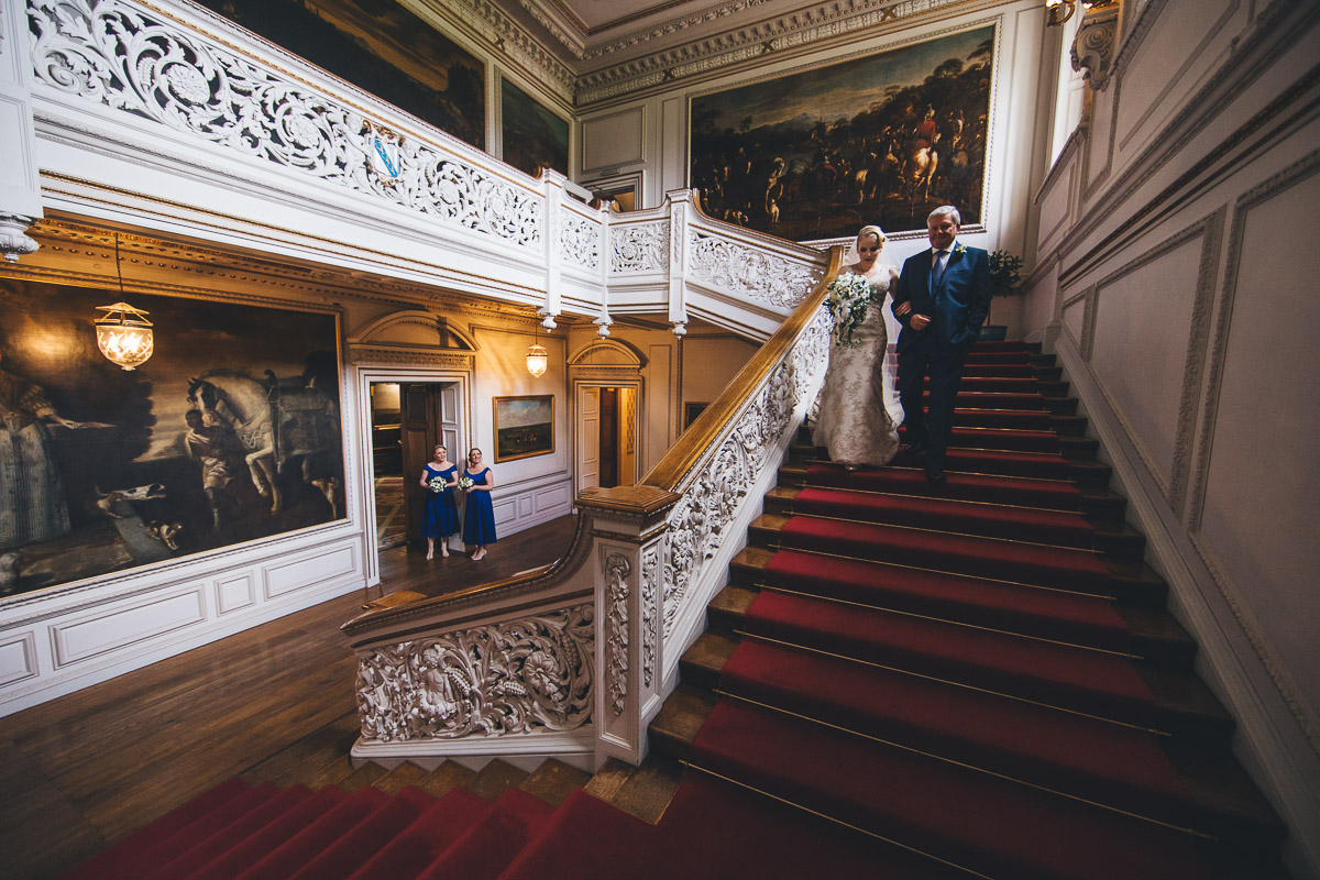 wide angle shots of grand staircase and bride walking down with her father