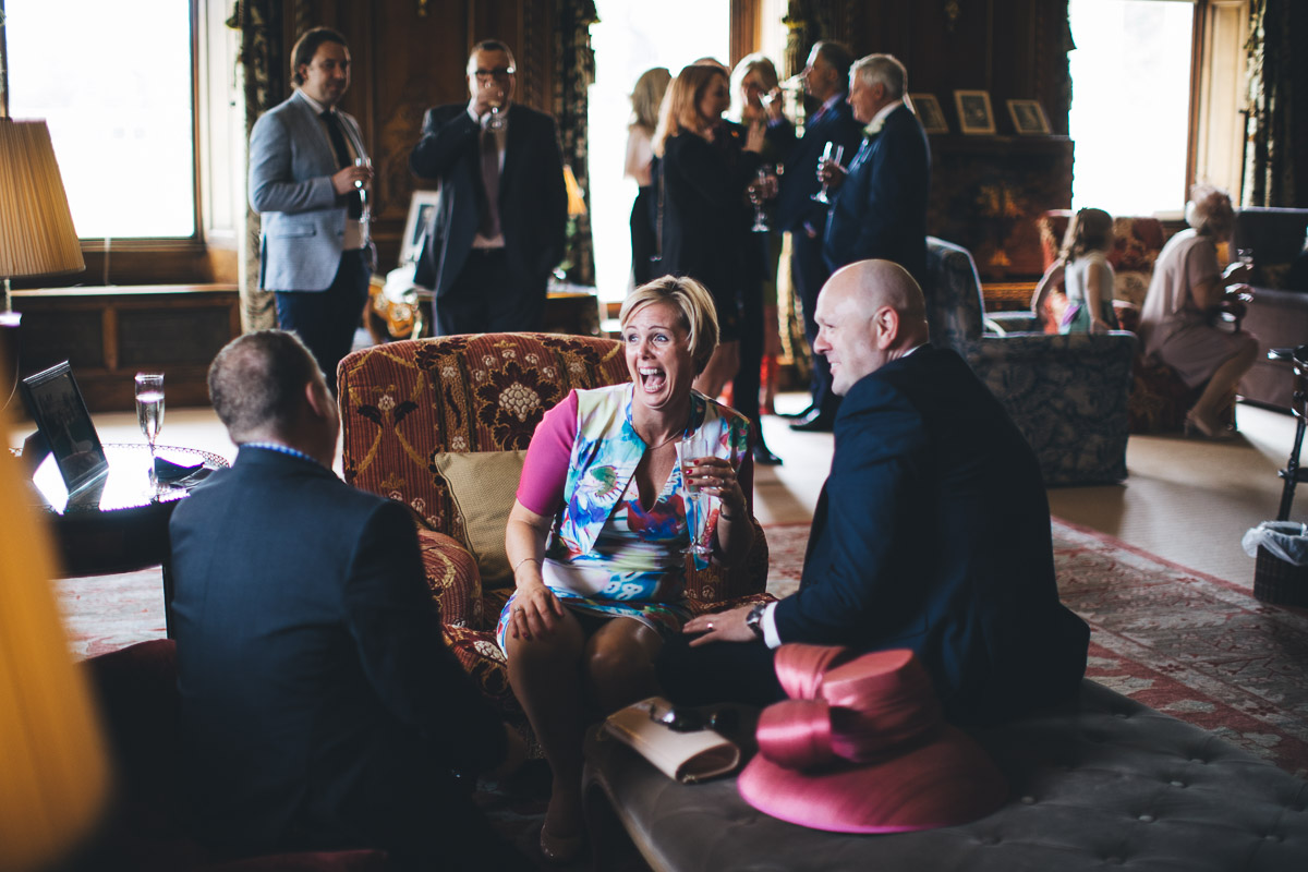 documentary style wedding photography a guest laughing