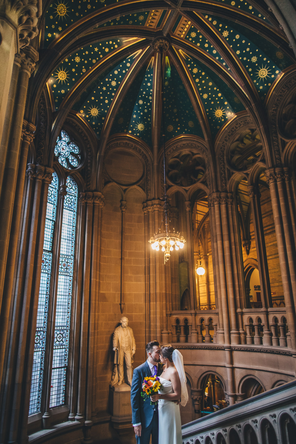 couple on the stairs for a wedding portrait in manchester