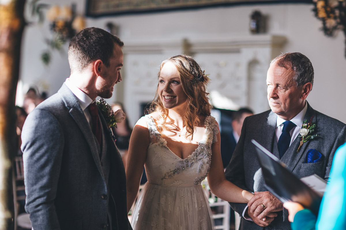 father of the brides gives away his daughter