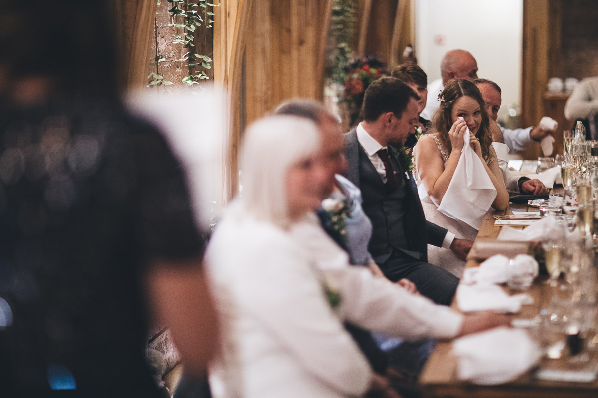 bride crying during the speeches