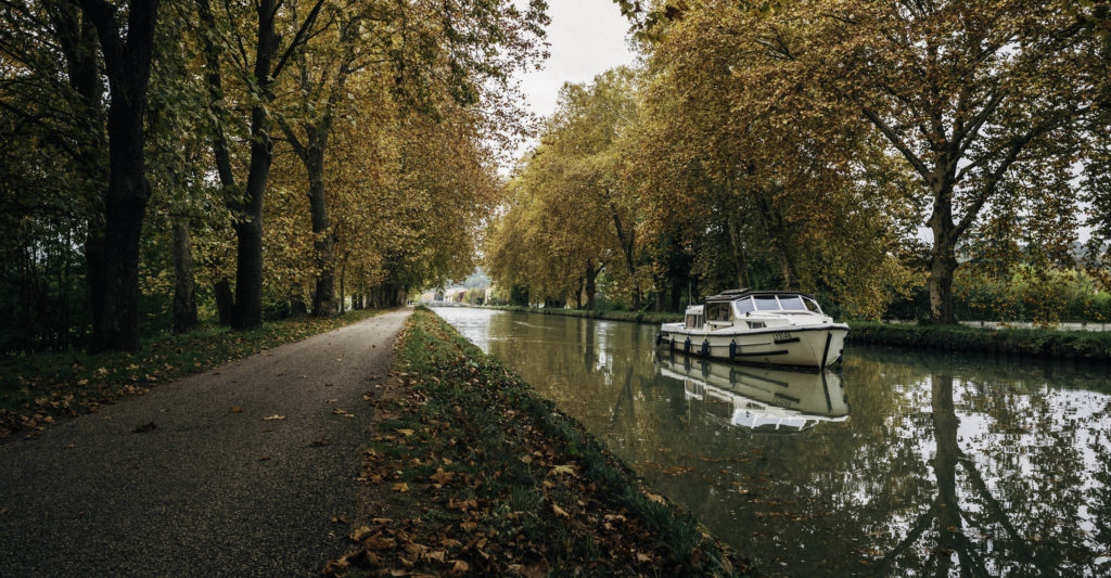 autumn scene of boat on the canal