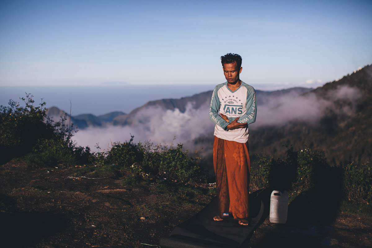 man meditating at base camp for mount rinjani