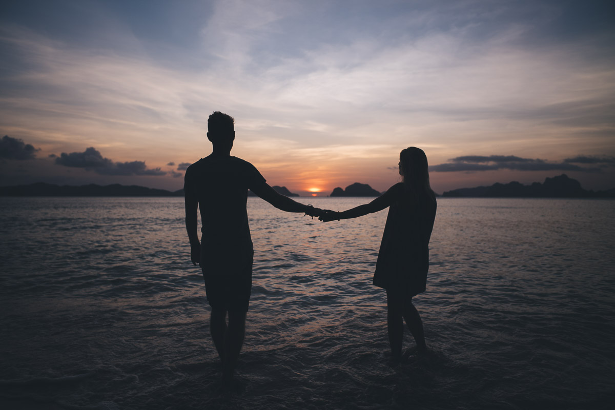 silhouette of couple against the sunset