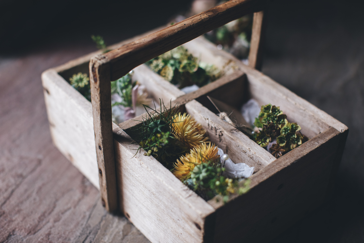 Flower buttonholes in wooden box