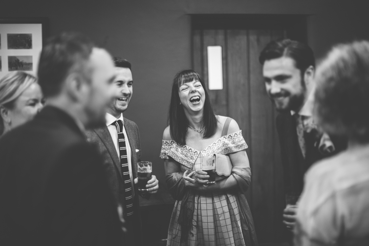 members of a wedding party smiling and laughing