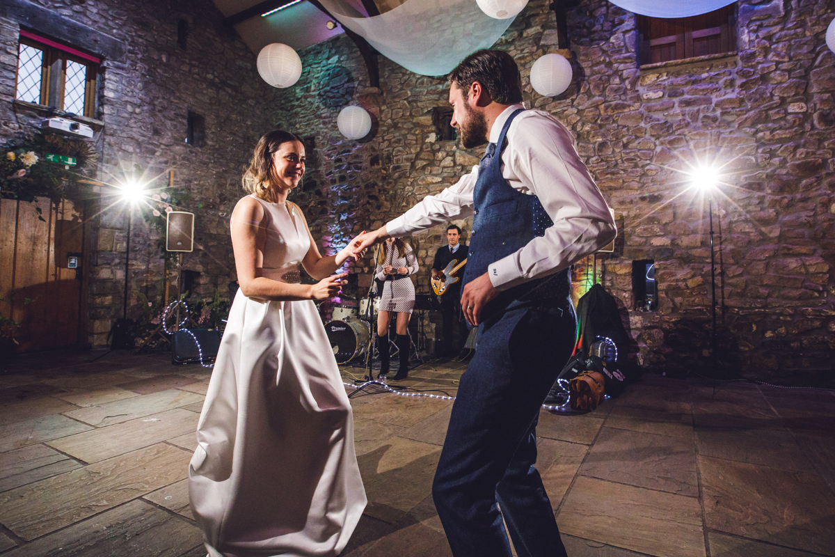 Bride and groom having their first dance at Tithe Barn Browsholme Hall
