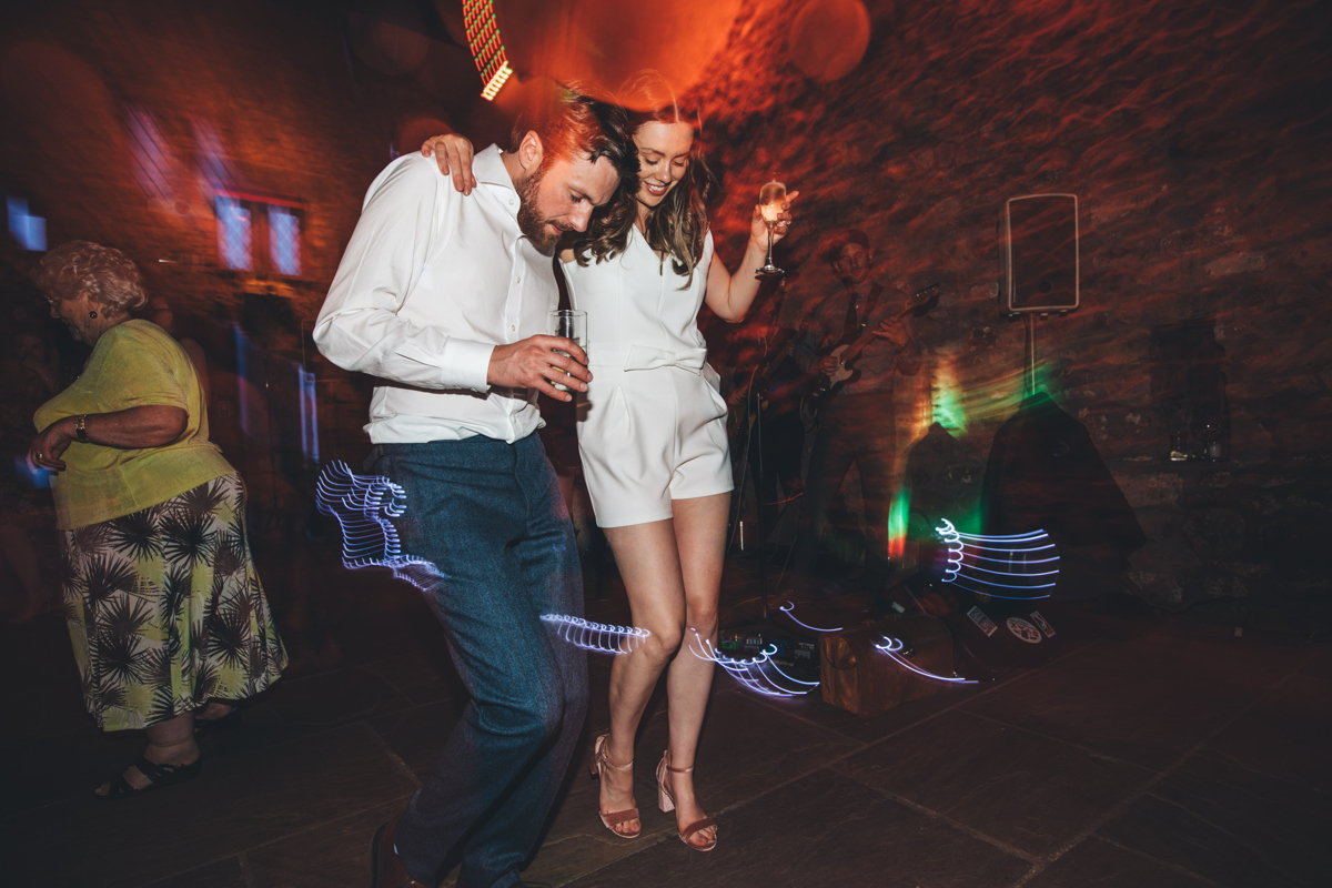 Bride and groom dancing on a stone floor