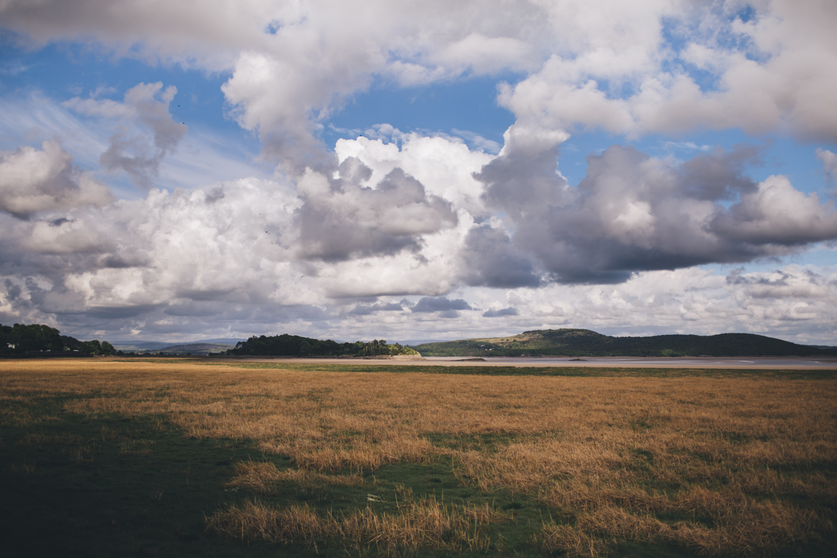 View towards the estuary at Grange-Over-Sands with blue skies and white clouds