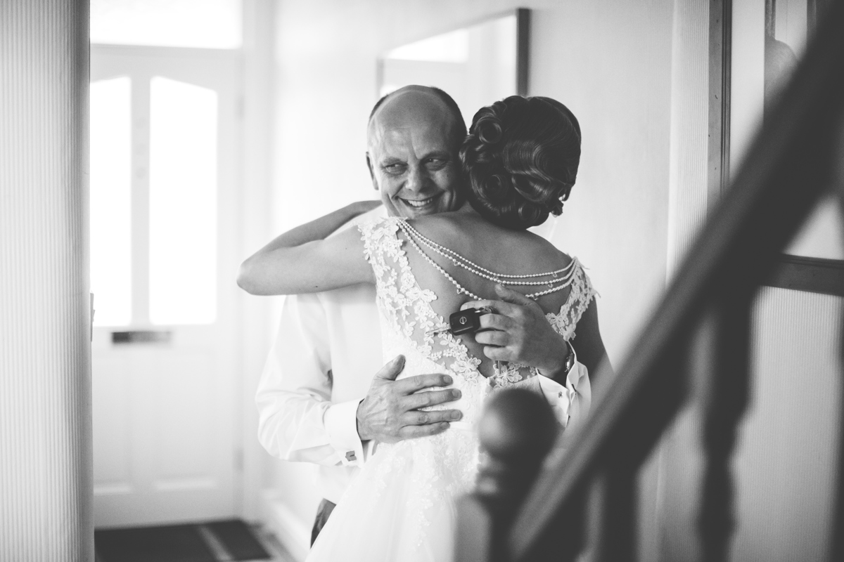 Bride hugging her father