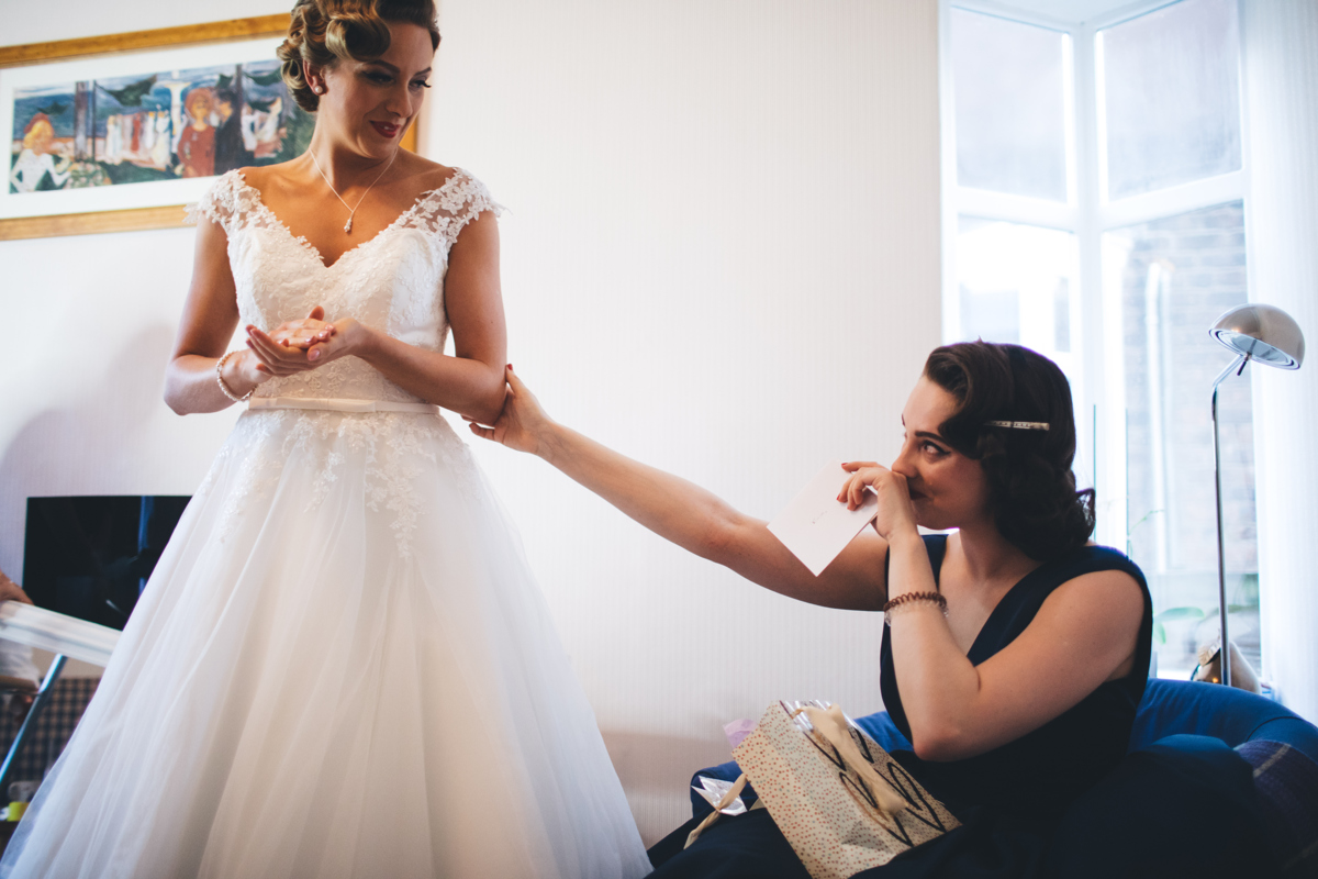 Bridesmaid crying after receiving a gift from the Bride