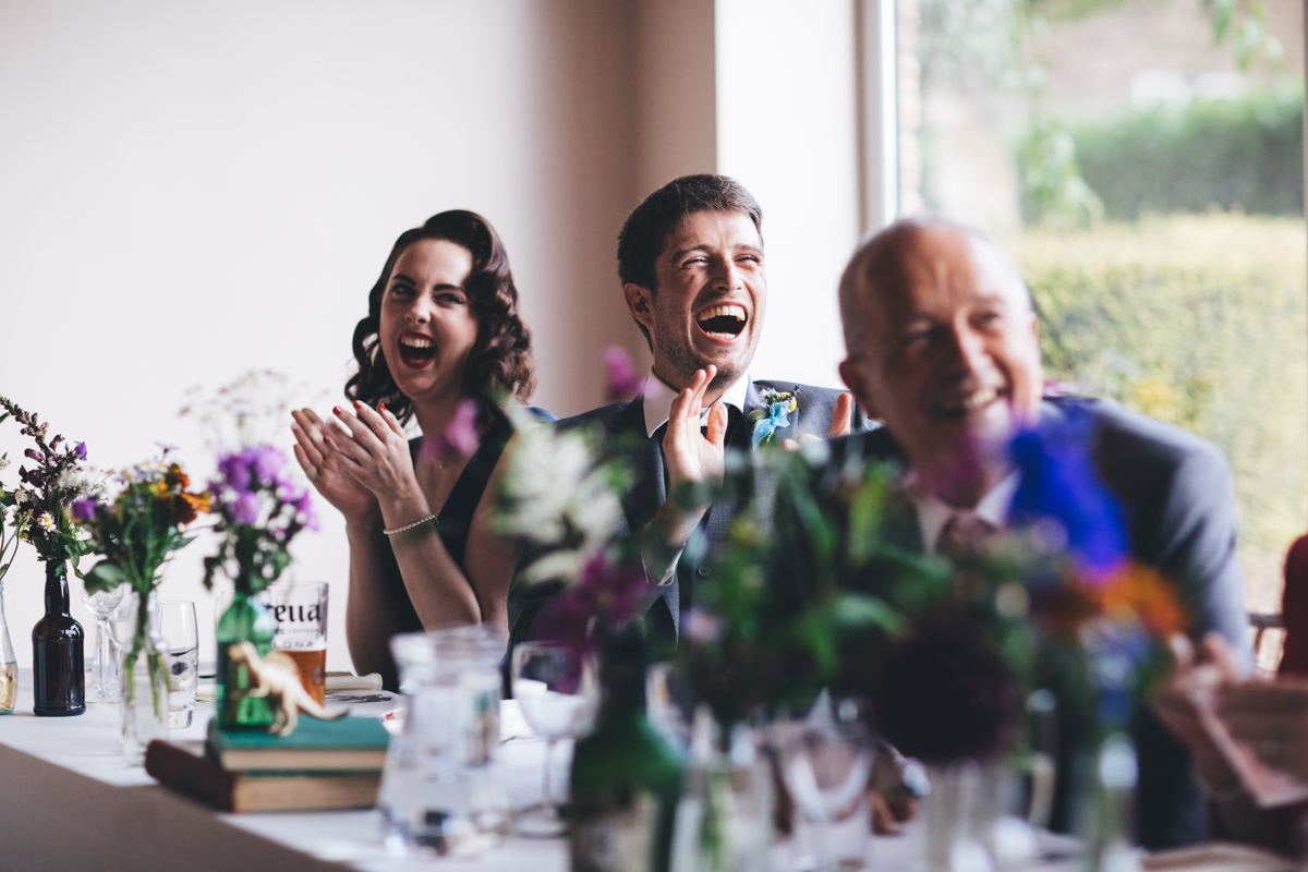 Wedding guests laughing and clapping