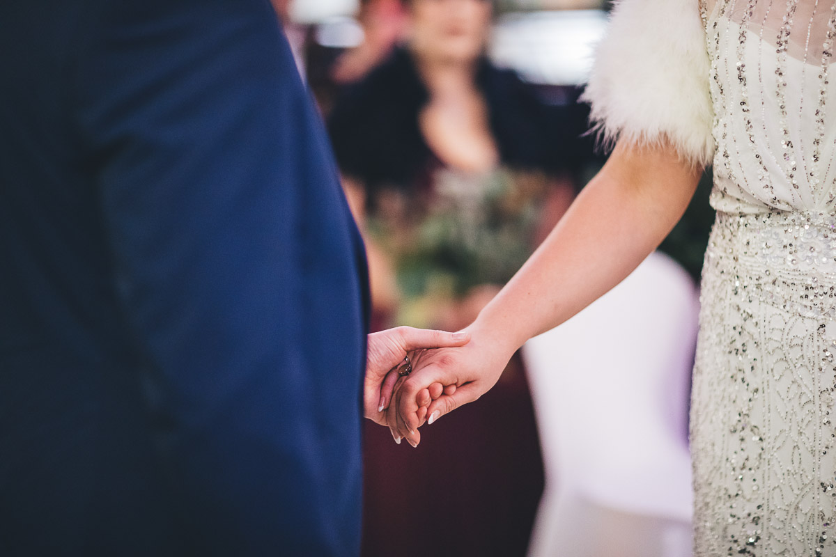 bride and groom holding hands