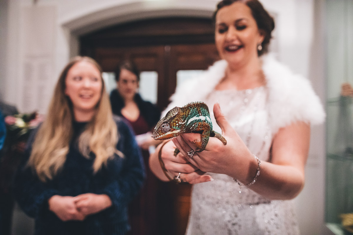 Bride holding a lizard