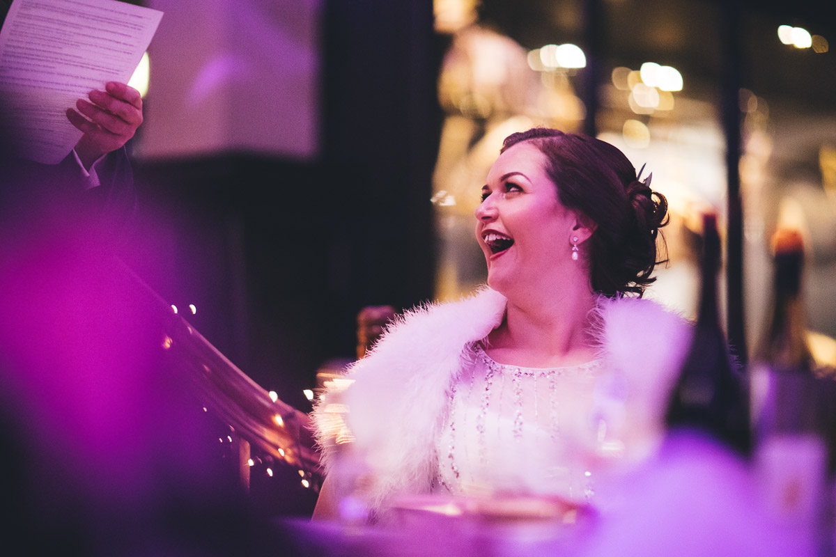 Bride smiling at grooms speech