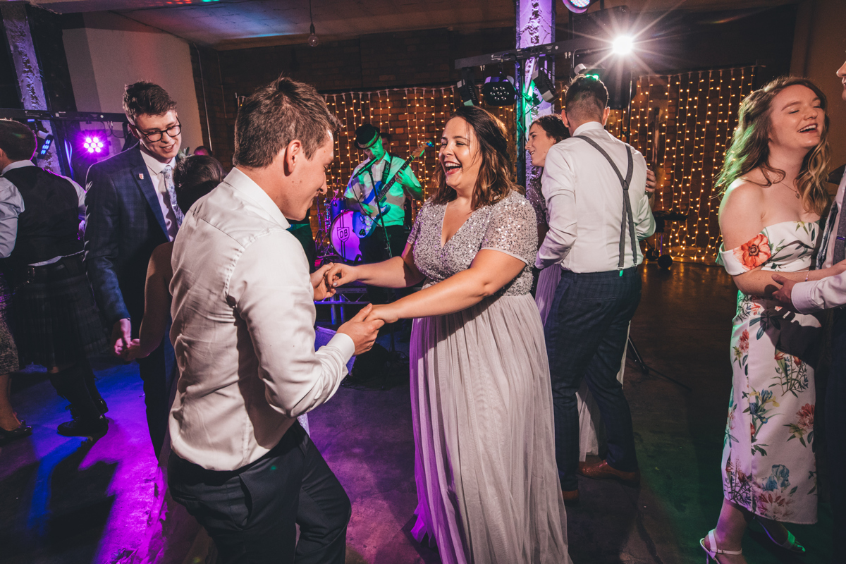 Wedding guests dancing at Victoria Warehouse, Manchester