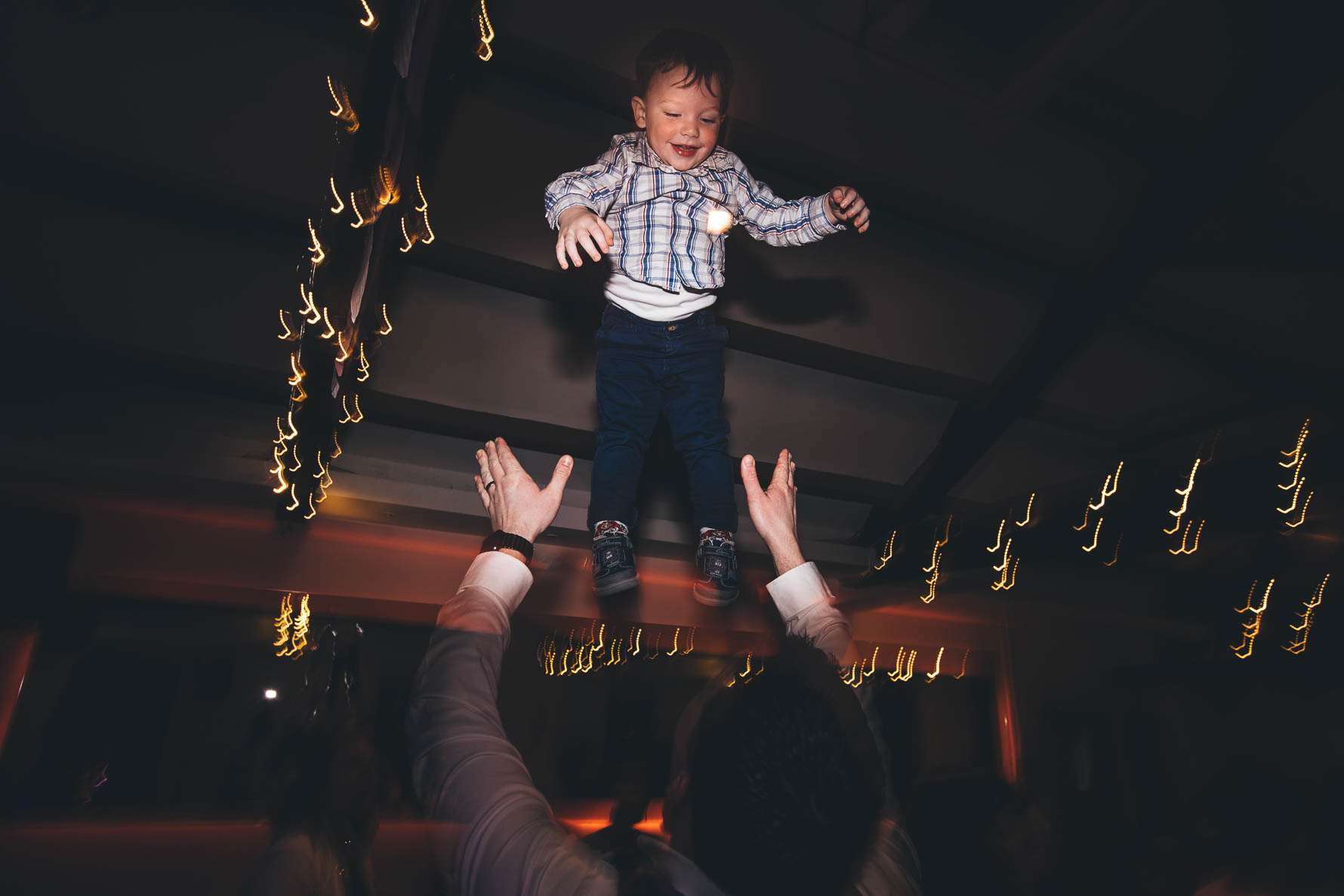 boy gets thrown in the air on the dance floor