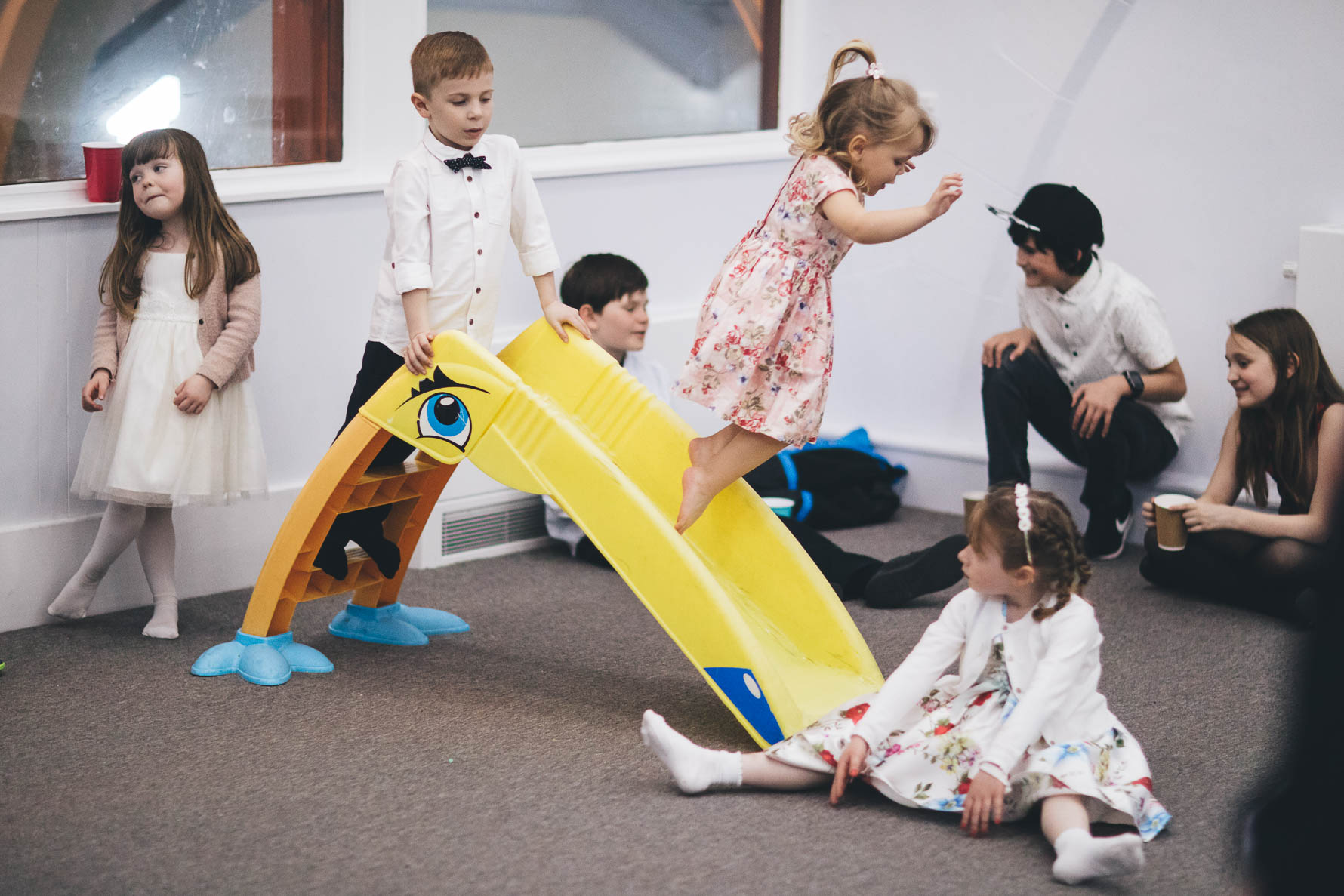 girl jumping off slide