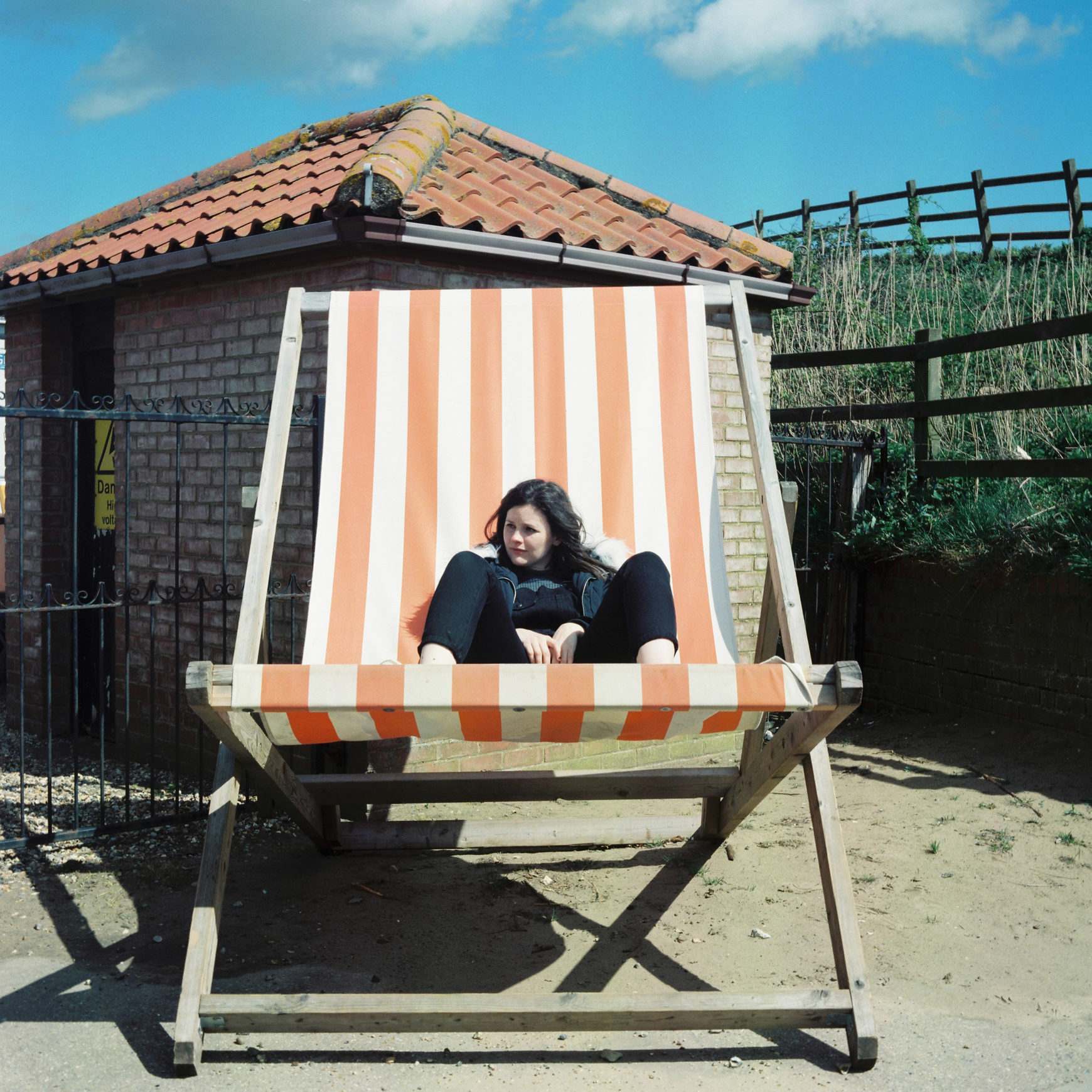 girl sat in a giant deck chair
