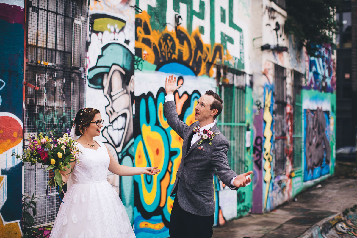 wedding portrait outside camp and furnace in a skate park