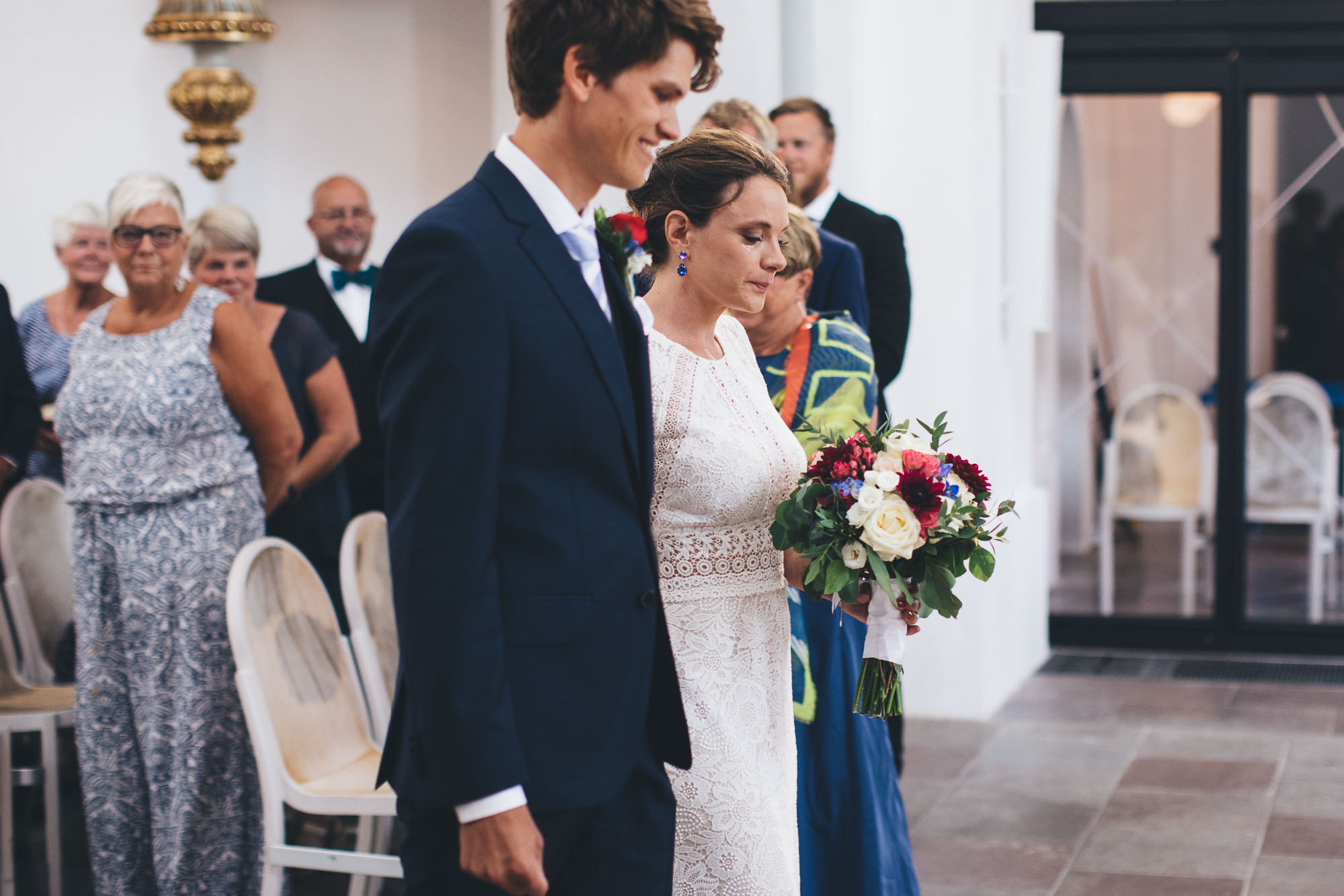 bride starts to cry coming down the aisle