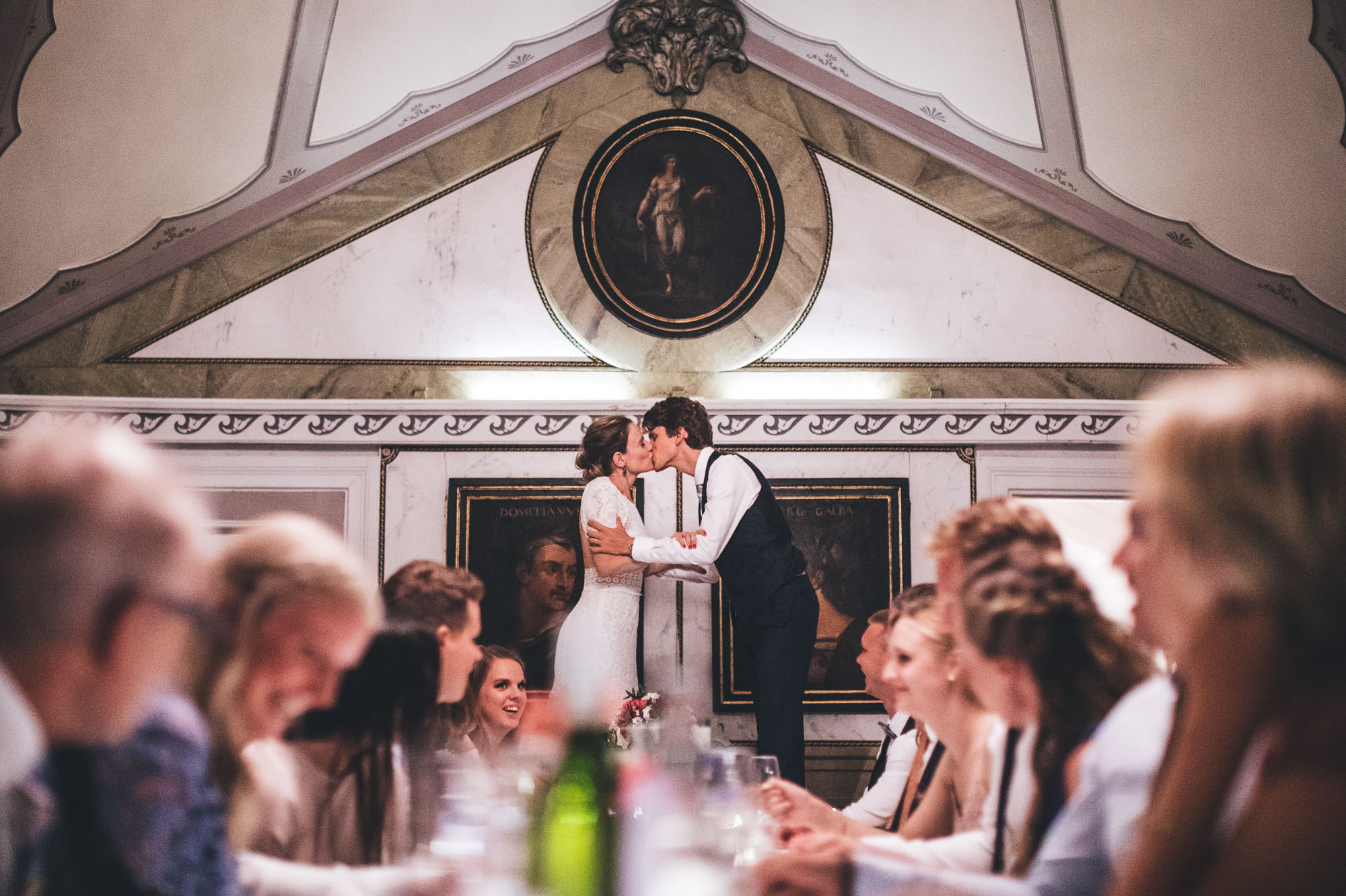 wedding tradition from scandinavia where couple stand on chairs to kiss