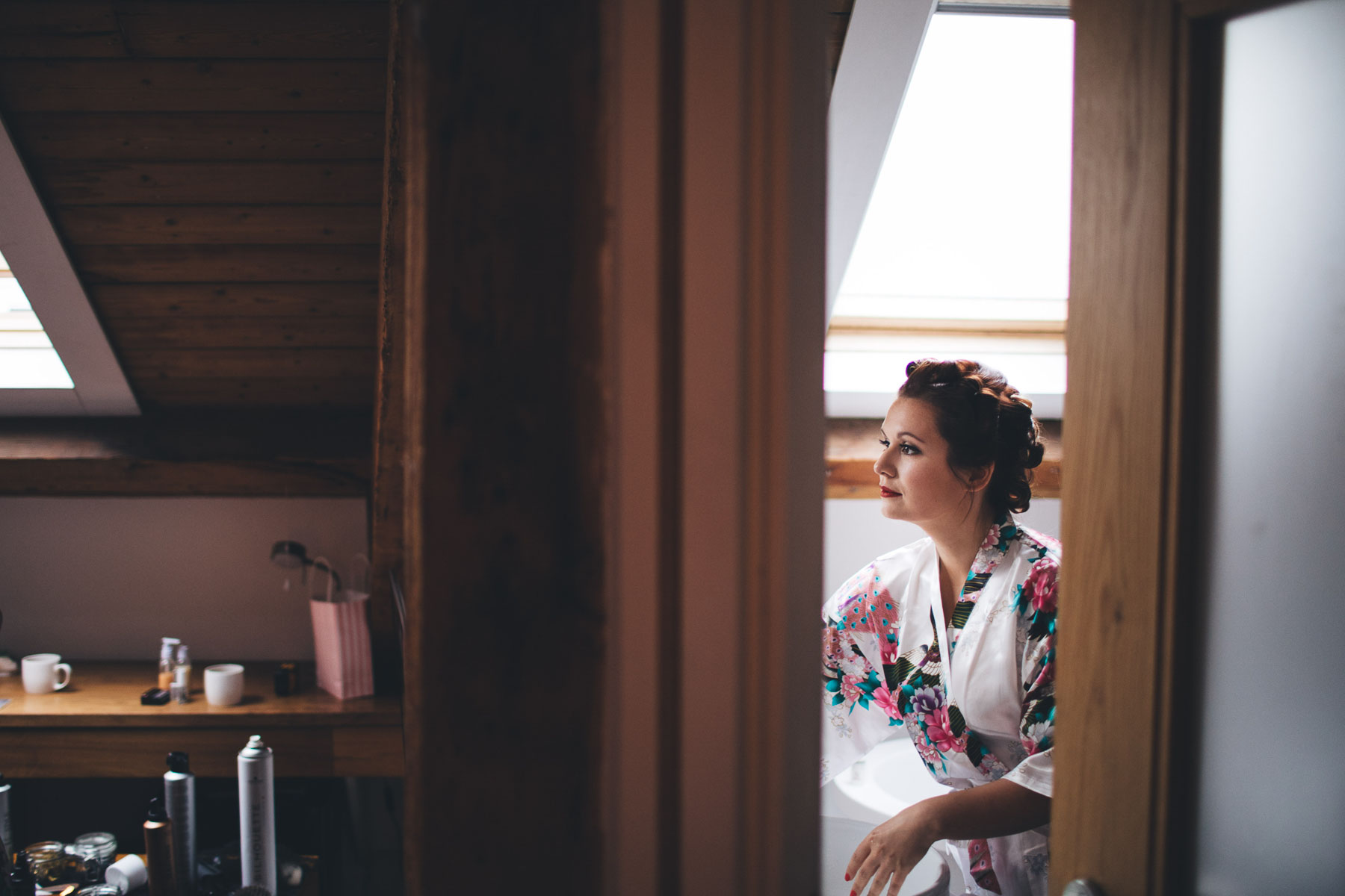 bride gets ready in the bathroom mirror