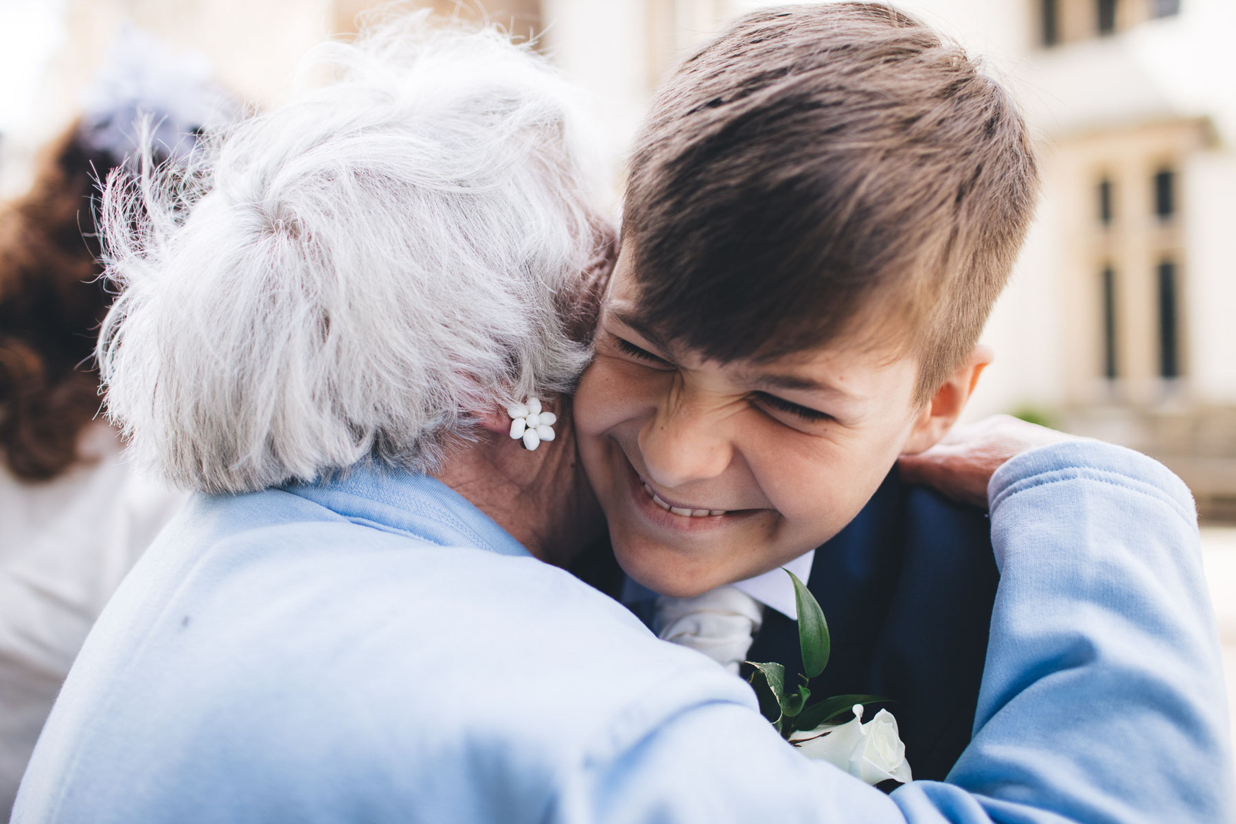 grandson hugs grandma before the wedding in manchester