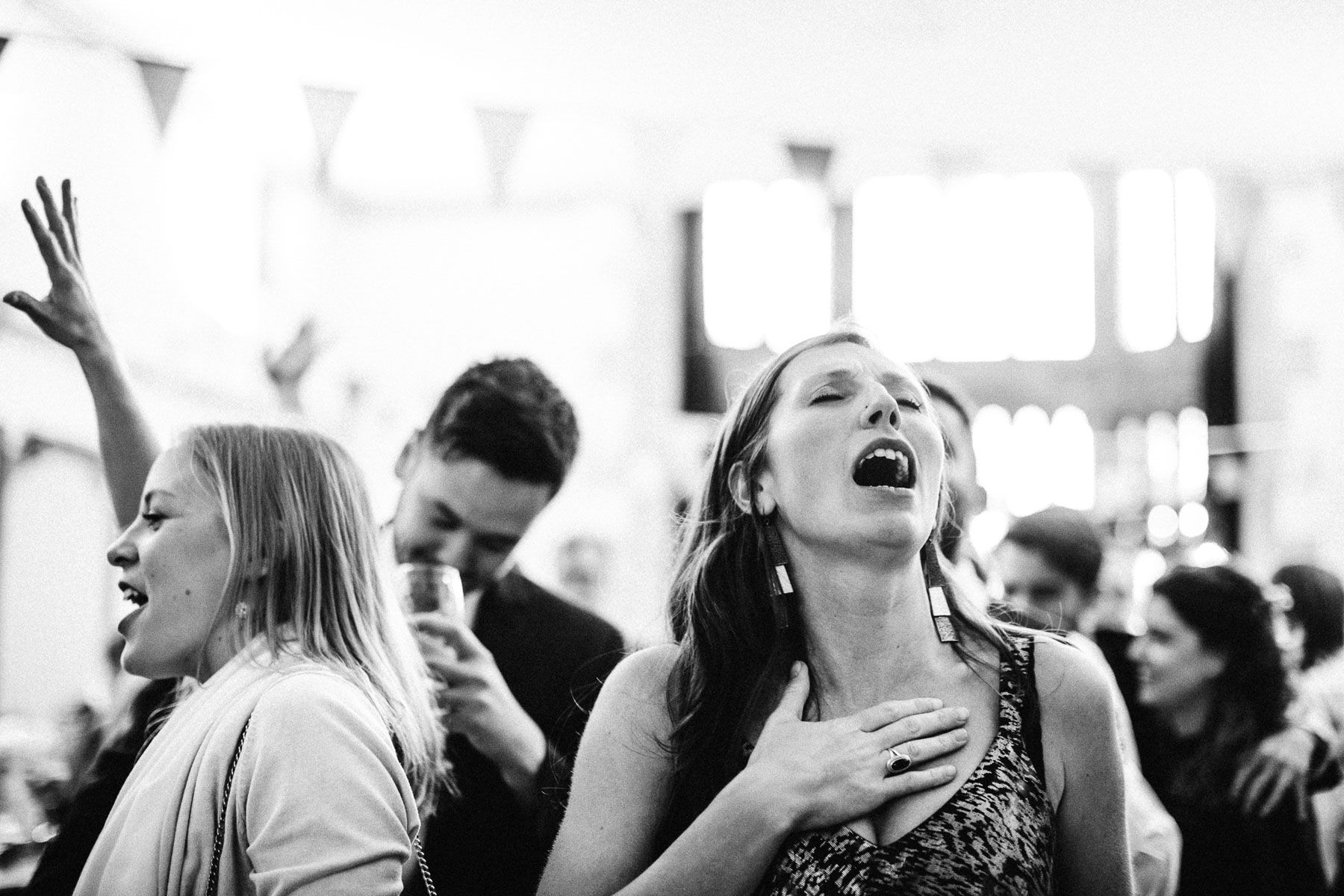 black and white shot of guests singing