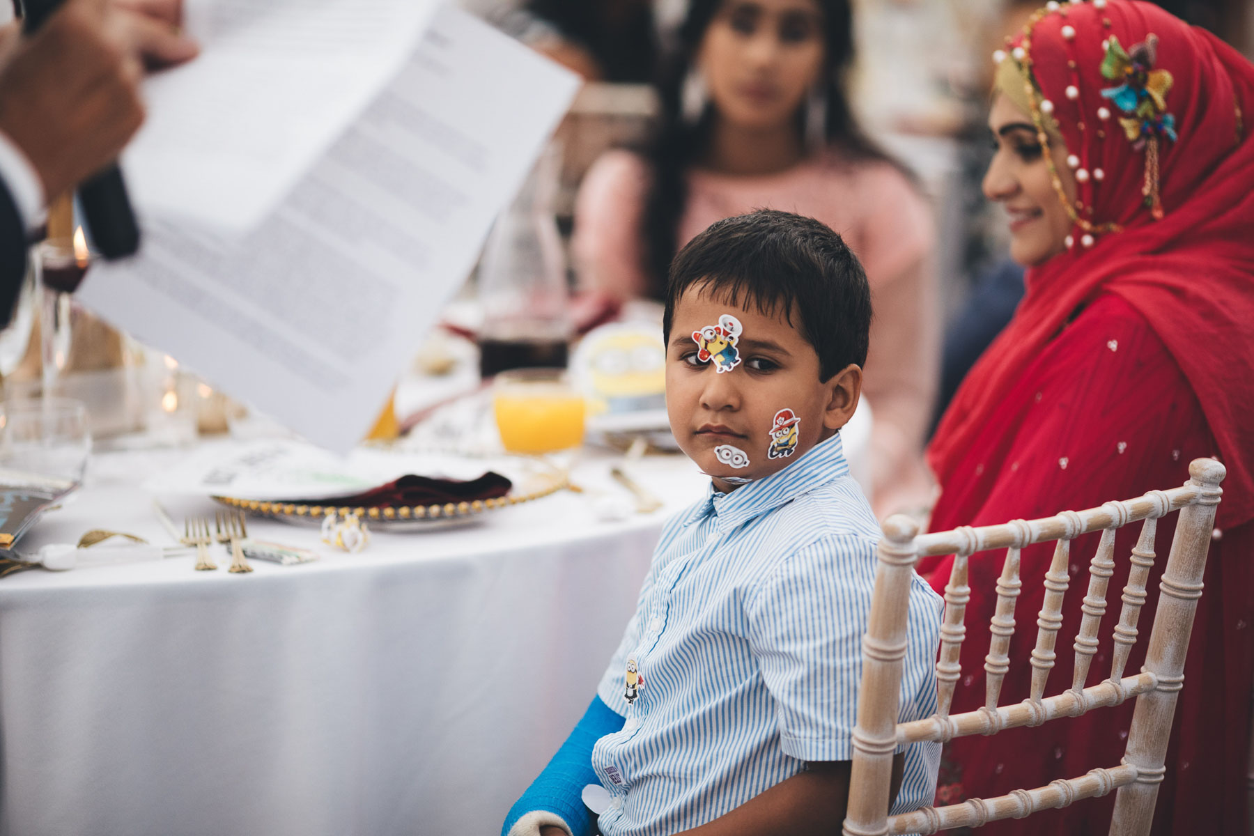 boy with stickers on his face