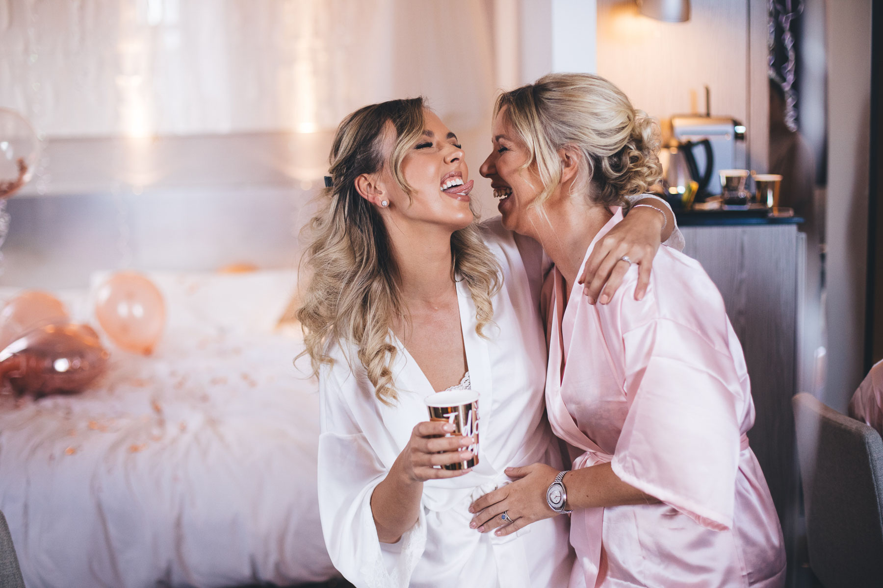bride goes to lick her friend at bridal prep in a hilarious moment between friends