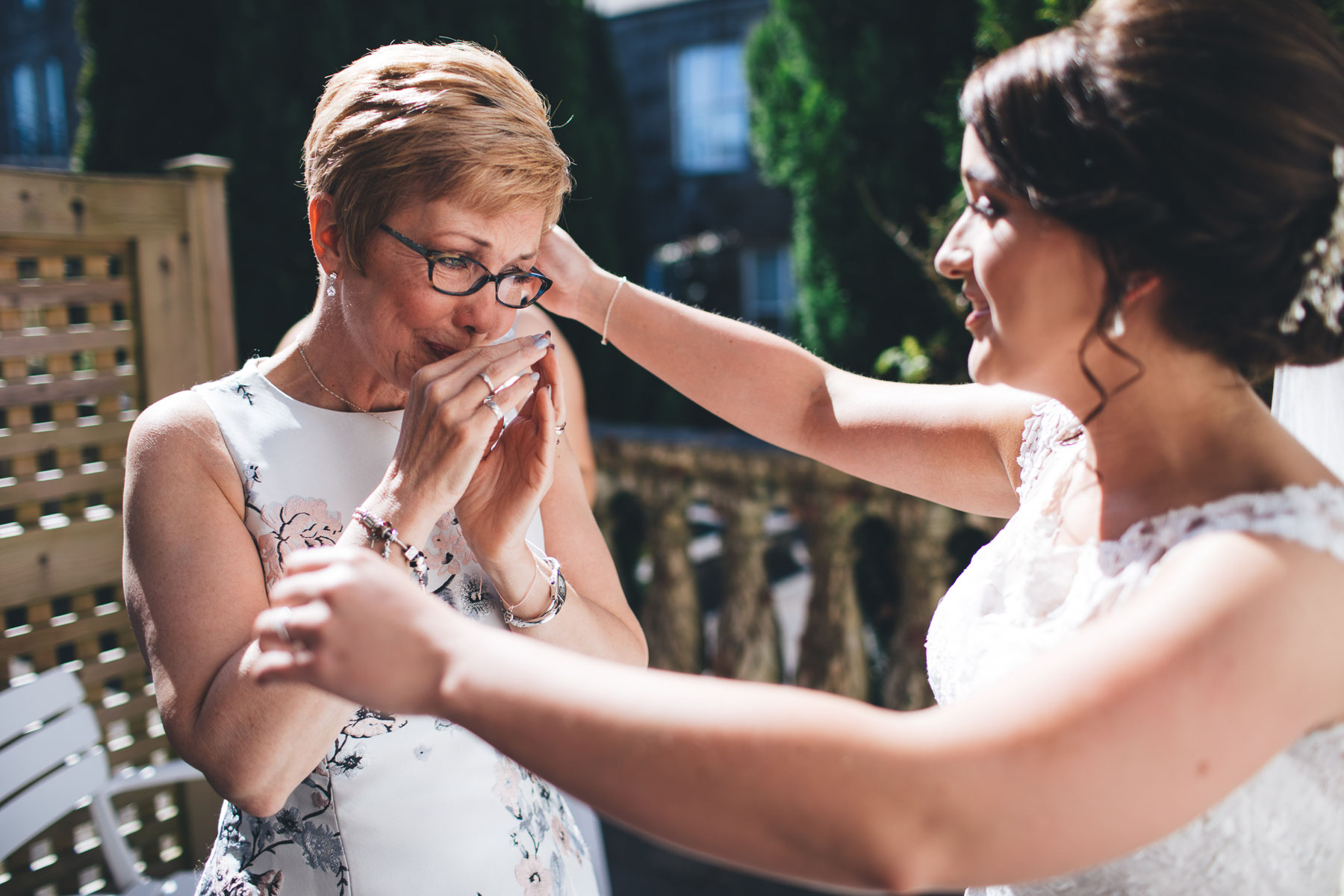 mother of the bride gets emotional at seeing her daughter in her wedding dress