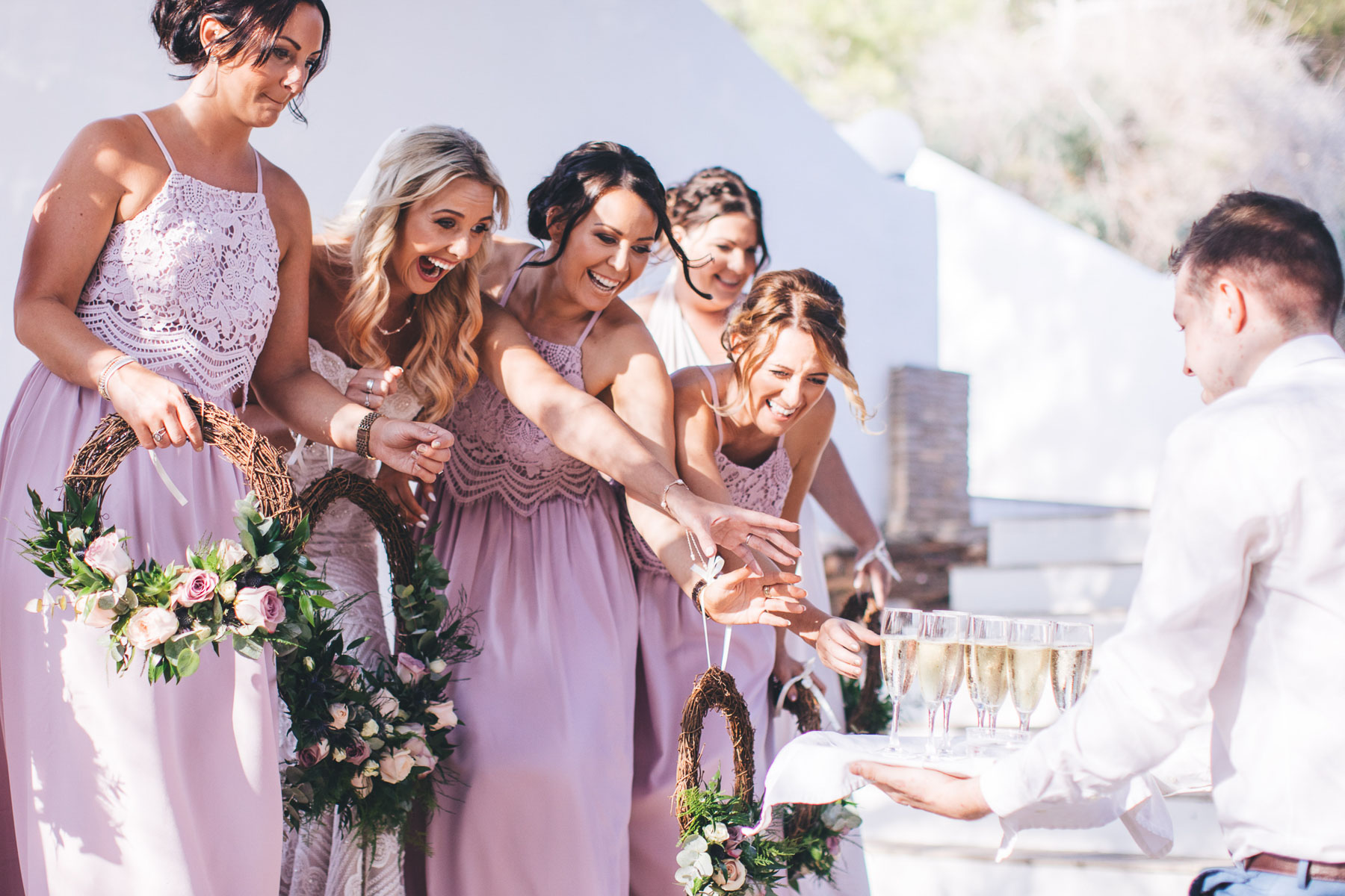 bride gets super excited at the arrival of the champagne