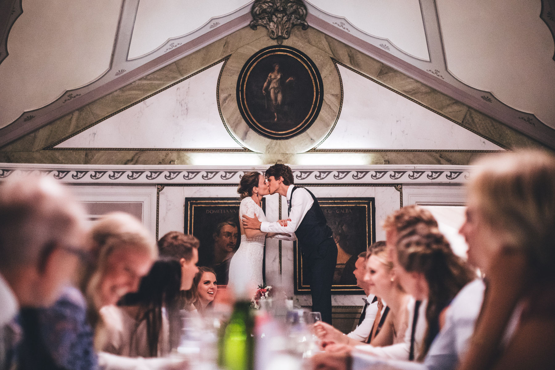 swedish wedding tradition of standing on their chairs to have a kiss as the guests clink their glasses